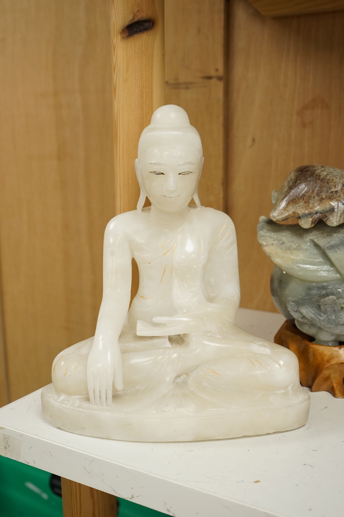 Two modern jade figures, together with a marble Buddha and a carved giltwood figure, largest 24cm wide